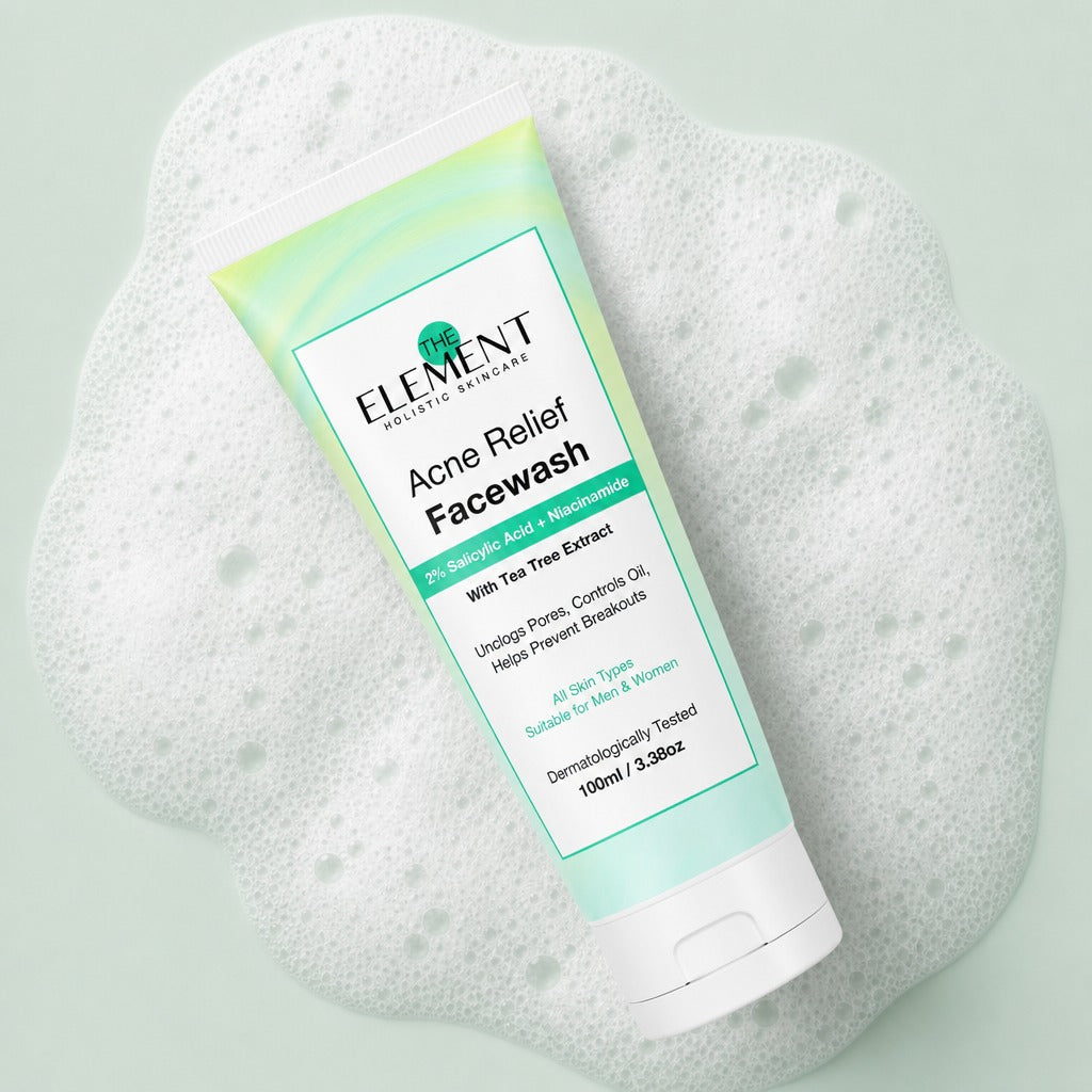 Acne Relief Face Wash tube on a bed of gentle cleansing foam