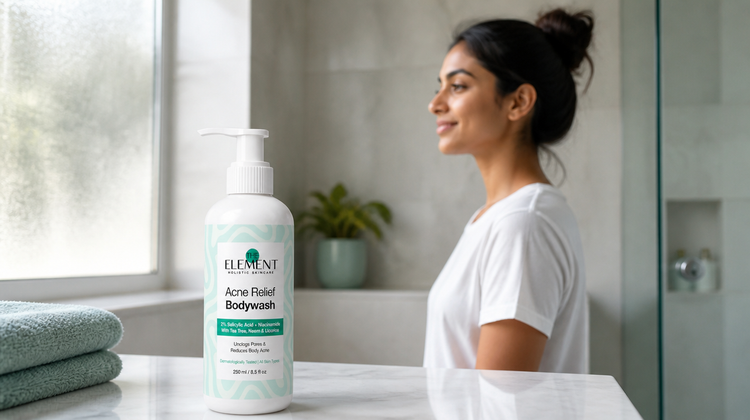 The Element Acne Relief Body Wash on a bright bathroom counter, with a woman in a white cotton t-shirt in the background
