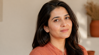 An Indian woman with even, luminous skin in soft directional daylight, illustrating a guide to identifying the different types of facial pigmentation