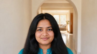 Indian woman in a teal kurta at home in the morning with calm skin, for a guide to using dapsone gel for acne