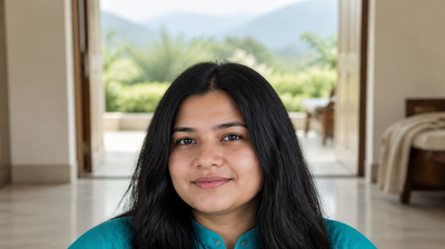 A young Indian woman with calm, clear skin on the veranda of a hill-station guesthouse, illustrating why skin breaks out when you travel
