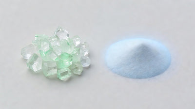Salicylic acid crystal with green accent beside niacinamide powder with blue accent for acne comparison